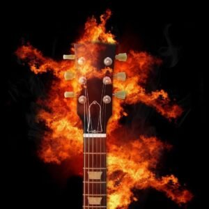 guitar head in flames with a black background